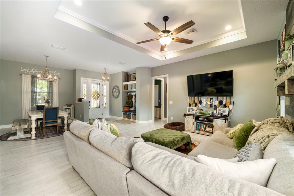 35638 Calla Court Leesburg, FL 34788 - Photo 16 of 44 a living room with furniture and a flat screen tv