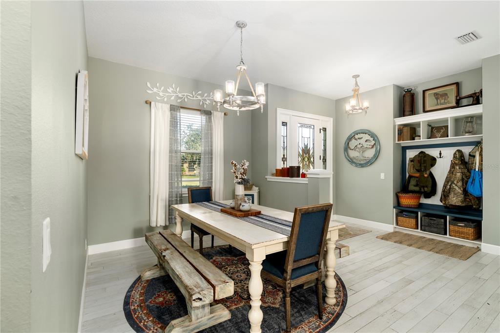 35638 Calla Court Leesburg, FL 34788 - Photo 18 of 44 a view of a dining room with furniture and chandelier