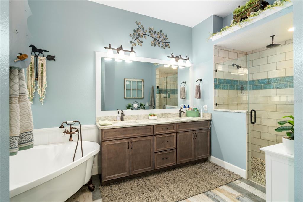 35638 Calla Court Leesburg, FL 34788 - Photo 22 of 44 a bathroom with a tub sink and mirror