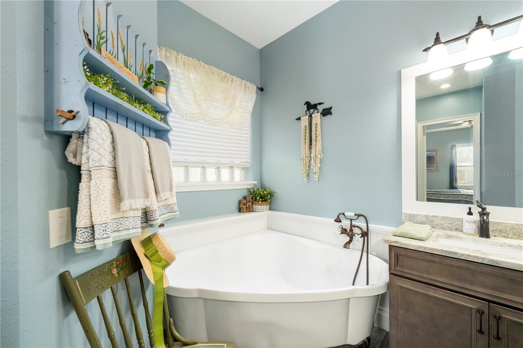 35638 Calla Court Leesburg, FL 34788 - Photo 23 of 44 a white bath tub sitting next to a white sink