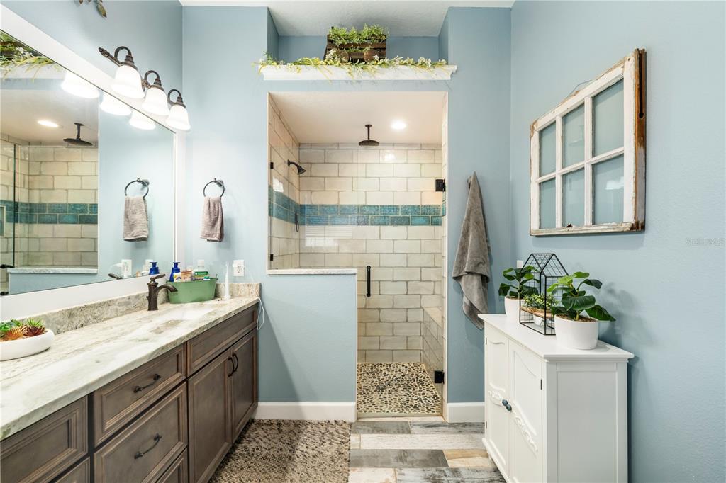 35638 Calla Court Leesburg, FL 34788 - Photo 24 of 44 a bathroom with a sink and a mirror