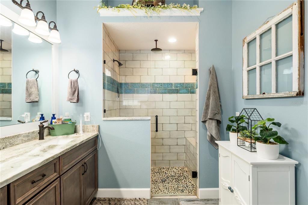 35638 Calla Court Leesburg, FL 34788 - Photo 25 of 44 a bathroom with a sink and a mirror