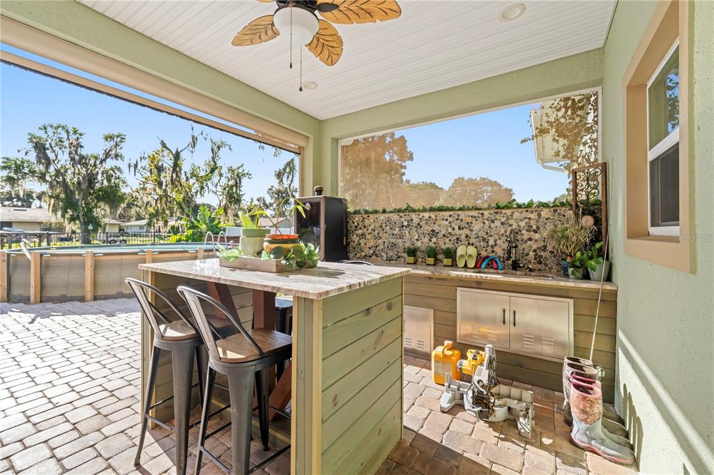 35638 Calla Court Leesburg, FL 34788 - Photo 28 of 44 a kitchen with a table chairs and chandelier
