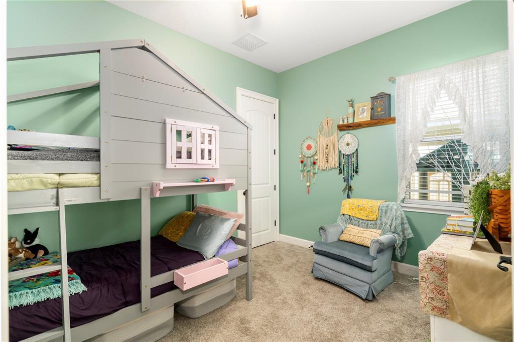 35638 Calla Court Leesburg, FL 34788 - Photo 31 of 44 a bedroom with furniture and a window