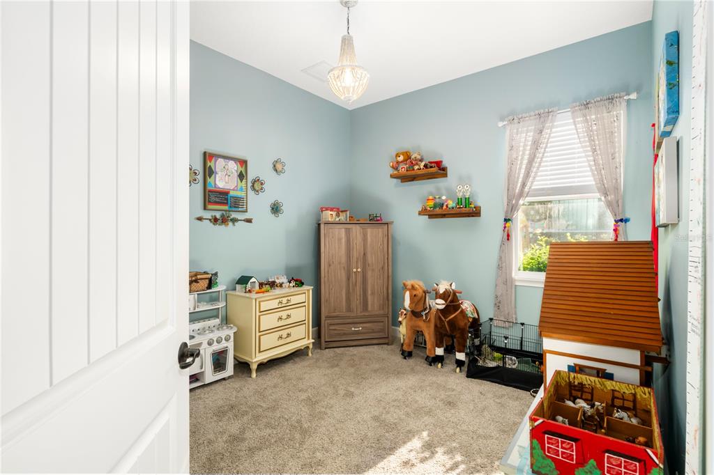 35638 Calla Court Leesburg, FL 34788 - Photo 35 of 44 a room with toys and a window