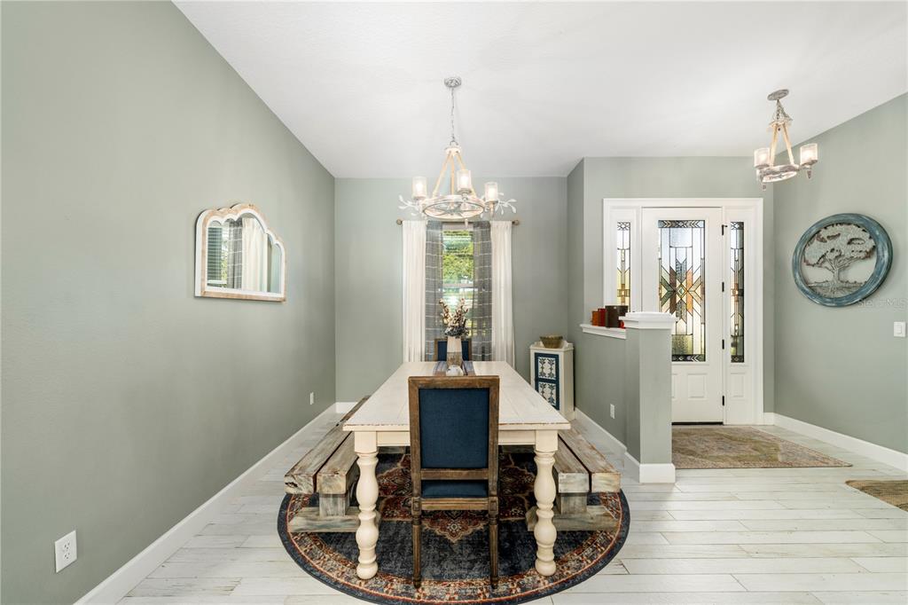 35638 Calla Court Leesburg, FL 34788 - Photo 9 of 44 a view of a dining room with furniture window and wooden floor