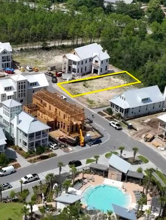 an aerial view of a house with a swimming pool yard and outdoor seating