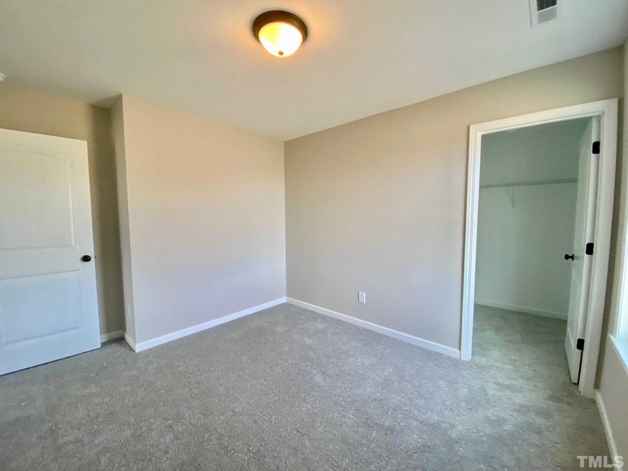 136 Mamie Road Benson, NC 27504 - Photo 26 of 32 a view of an empty room