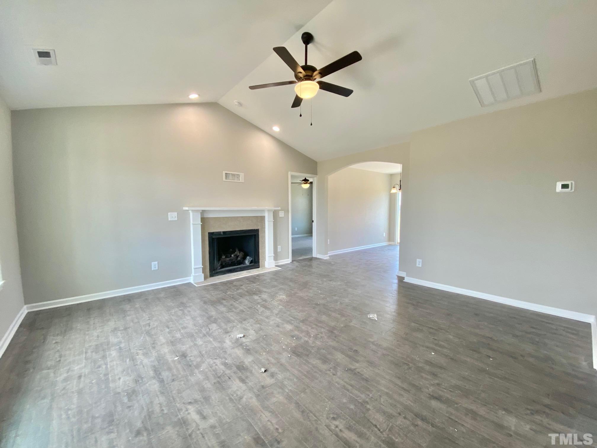 136 Mamie Road Benson, NC 27504 - Photo 5 of 32 an empty room with ceiling fan and entryway