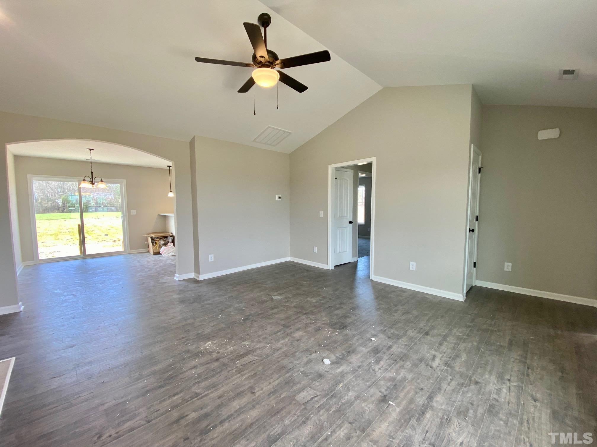 136 Mamie Road Benson, NC 27504 - Photo 7 of 32 a view of an empty room with a window
