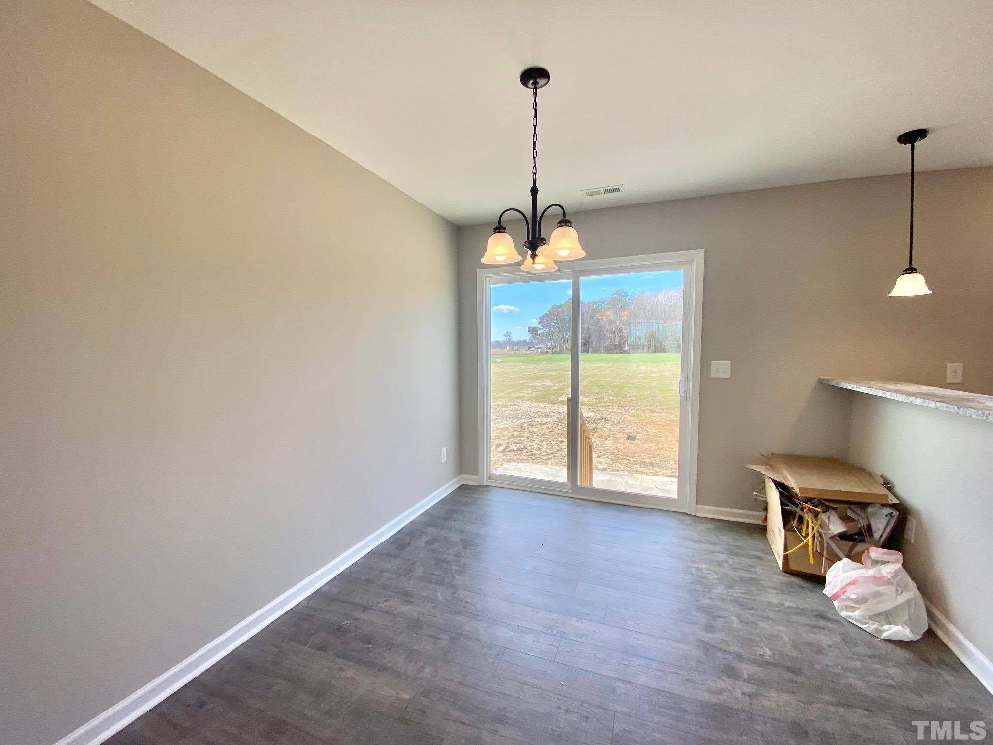 136 Mamie Road Benson, NC 27504 - Photo 10 of 32 a view of an empty room with a window