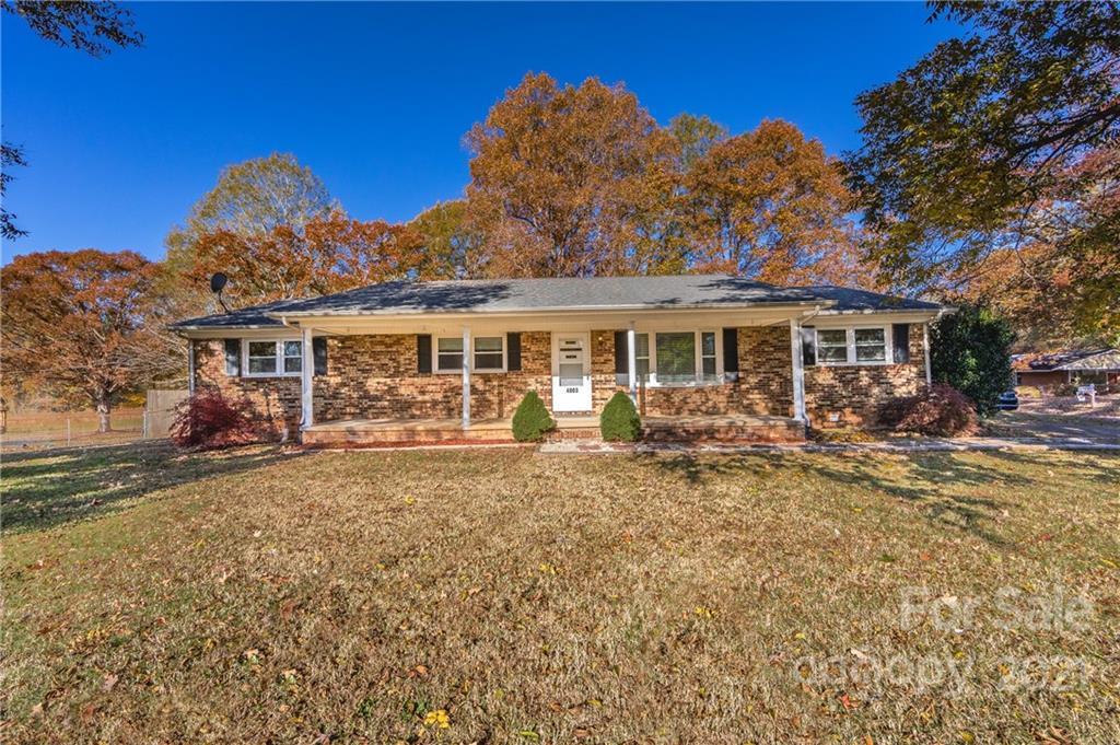 4003 Beaty Road Gastonia, NC 28056 - Photo 1 of 41 a view of a house with a yard patio and fire pit
