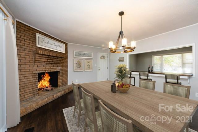 4003 Beaty Road Gastonia, NC 28056 - Photo 17 of 41 a kitchen with a chandelier appliances and living room view