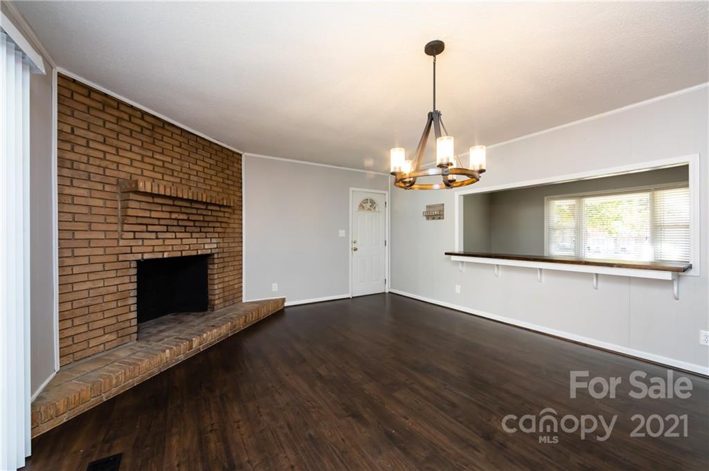 4003 Beaty Road Gastonia, NC 28056 - Photo 18 of 41 a view of a room with wooden floor fireplace and a window