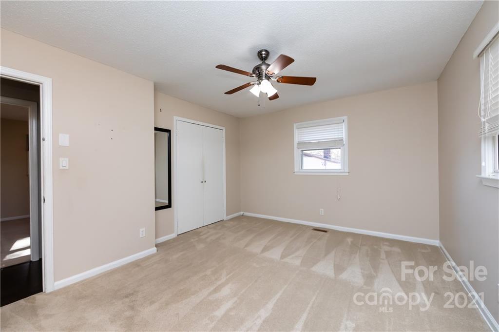 4003 Beaty Road Gastonia, NC 28056 - Photo 22 of 41 a view of a big room with carpet and windows