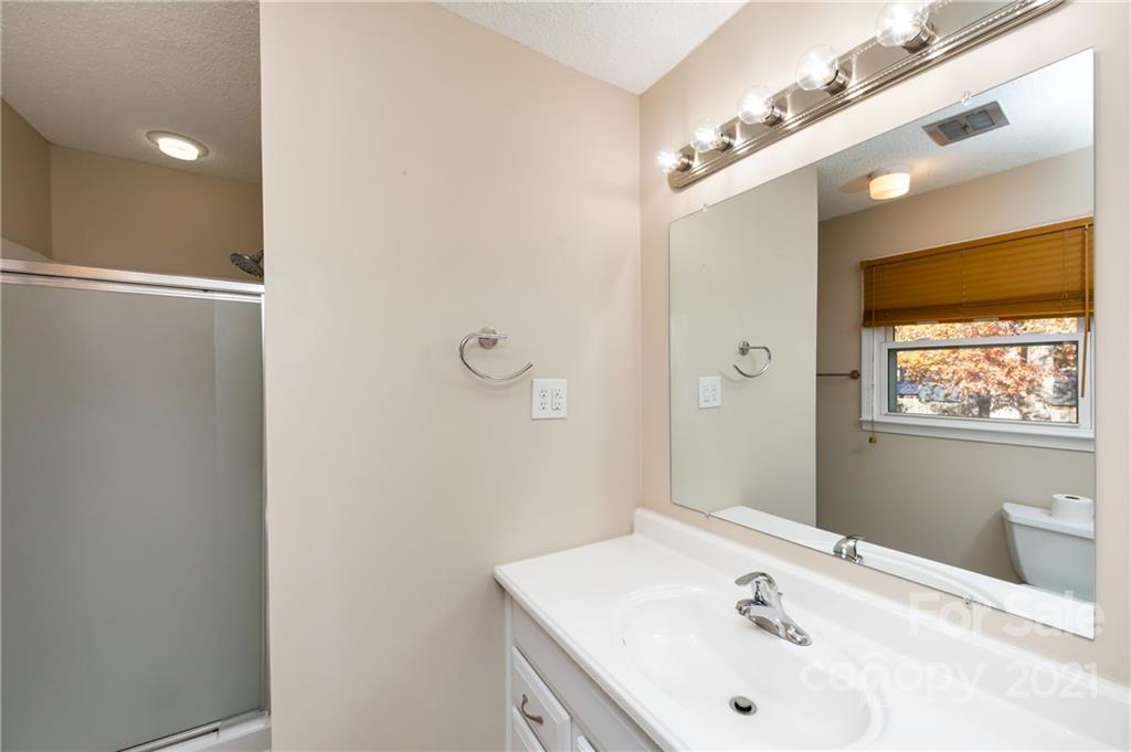 4003 Beaty Road Gastonia, NC 28056 - Photo 23 of 41 a bathroom with a sink and shower