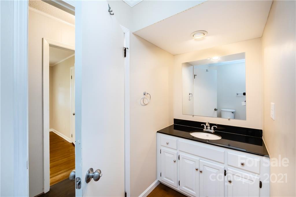 4003 Beaty Road Gastonia, NC 28056 - Photo 28 of 41 a bathroom with a sink and a mirror