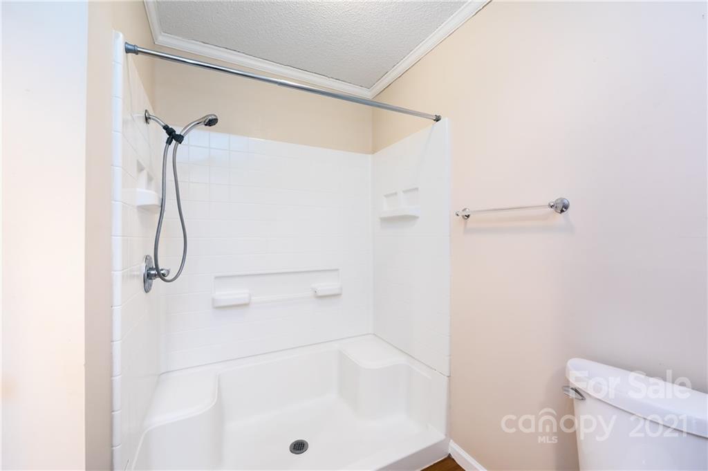 4003 Beaty Road Gastonia, NC 28056 - Photo 29 of 41 a bathroom with a bath tub with a shower