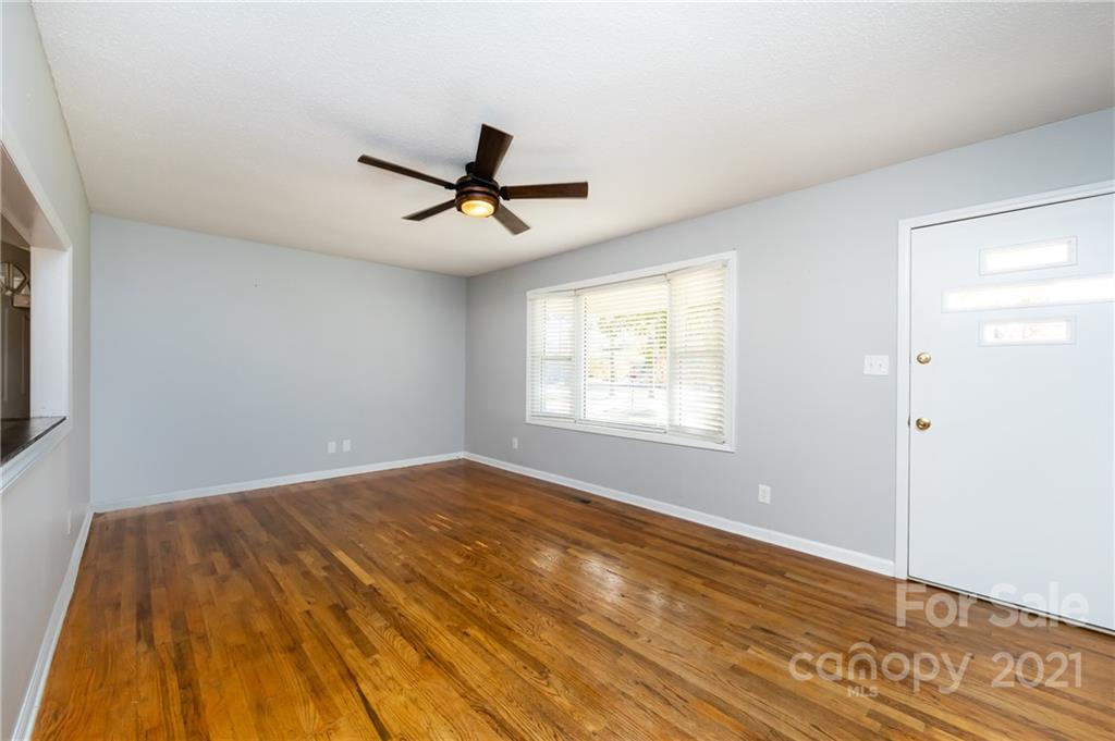 4003 Beaty Road Gastonia, NC 28056 - Photo 5 of 41 a view of empty room with wooden floor and fan