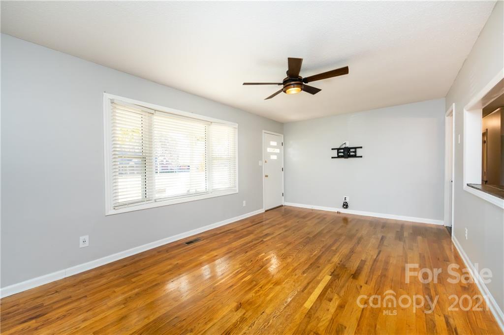 4003 Beaty Road Gastonia, NC 28056 - Photo 6 of 41 a view of empty room with wooden floor and fan