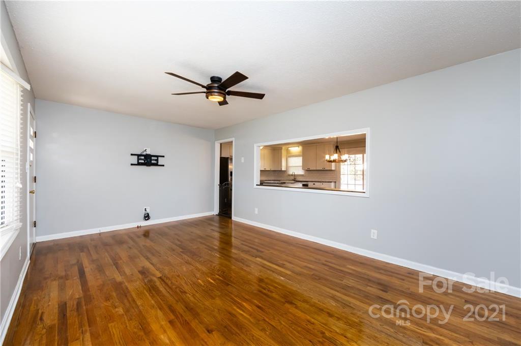 4003 Beaty Road Gastonia, NC 28056 - Photo 7 of 41 a view of empty room with wooden floor and fan