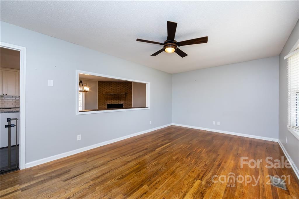 4003 Beaty Road Gastonia, NC 28056 - Photo 8 of 41 a view of a big room with wooden floor and windows