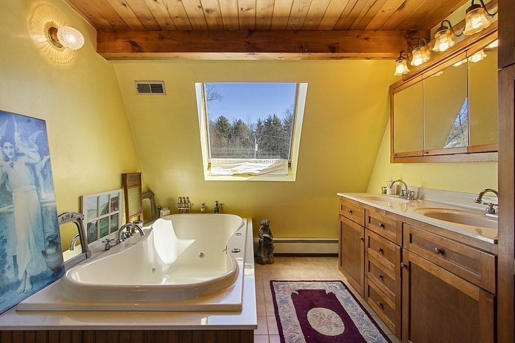 178 Wallace Hill Road Townsend, MA 01469 - Photo 13 of 42 a bathroom with a sink and a mirror