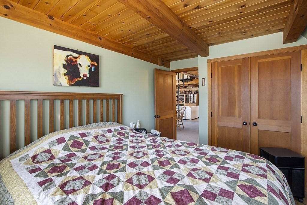 178 Wallace Hill Road Townsend, MA 01469 - Photo 15 of 42 a bedroom with a bed and a rug
