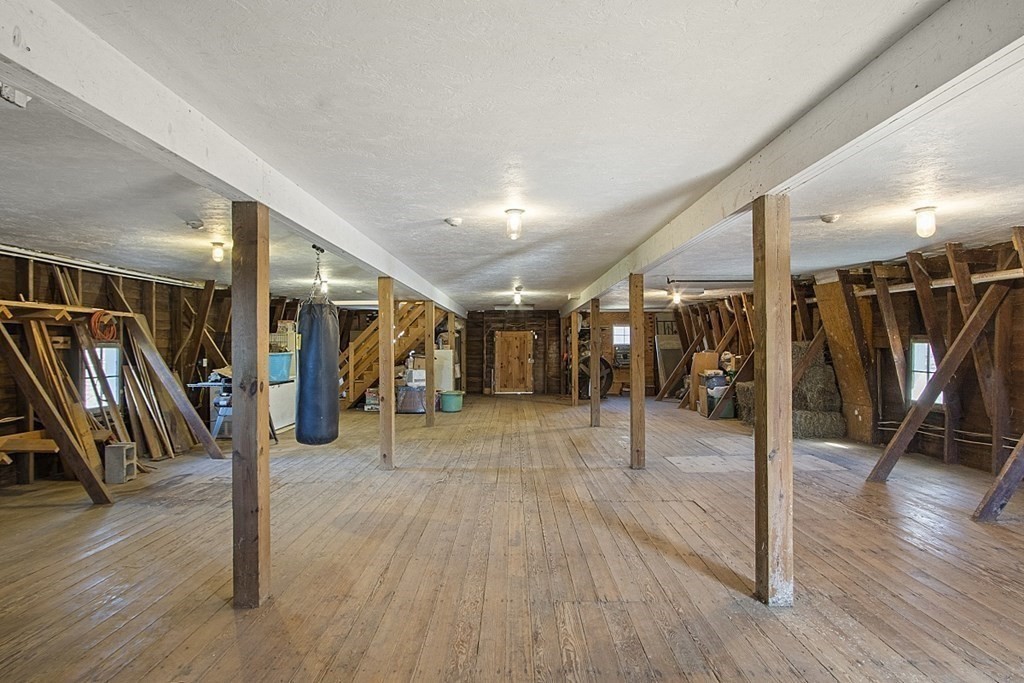 178 Wallace Hill Road Townsend, MA 01469 - Photo 22 of 42 a view of a hall with wooden floor