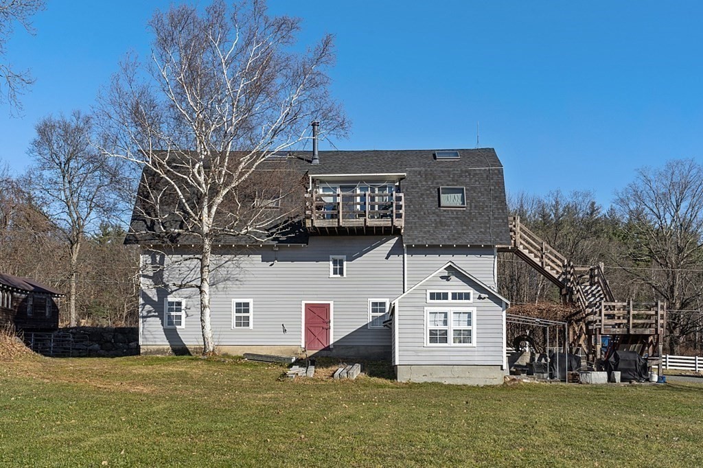 178 Wallace Hill Road Townsend, MA 01469 - Photo 26 of 42 a front view of a house with a yard