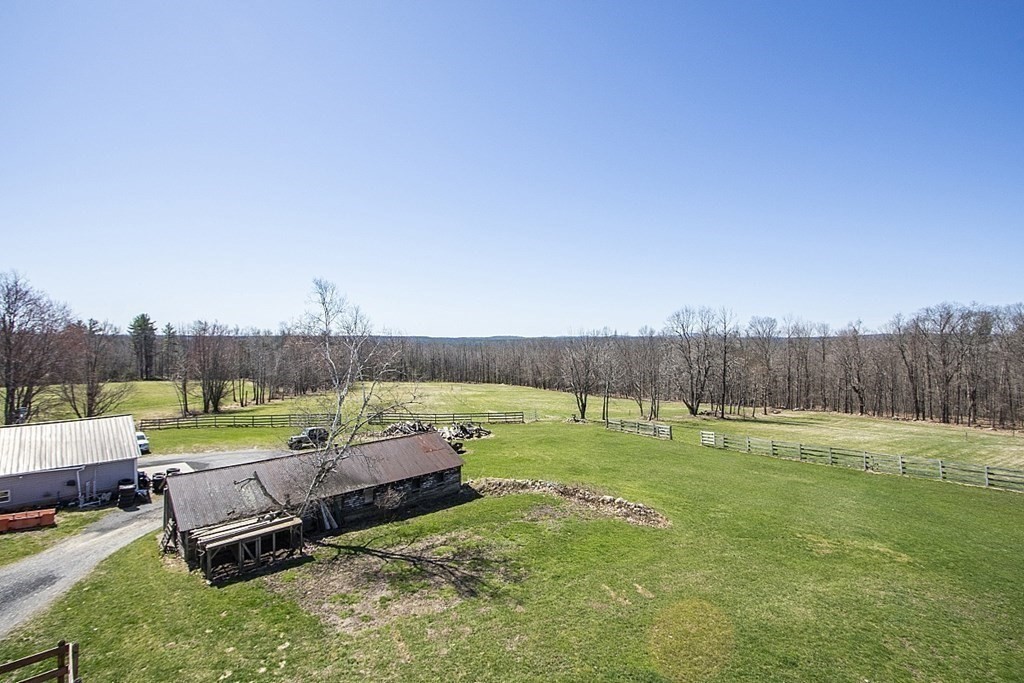 178 Wallace Hill Road Townsend, MA 01469 - Photo 33 of 42 a view of a backyard with lawn furniture and a yard