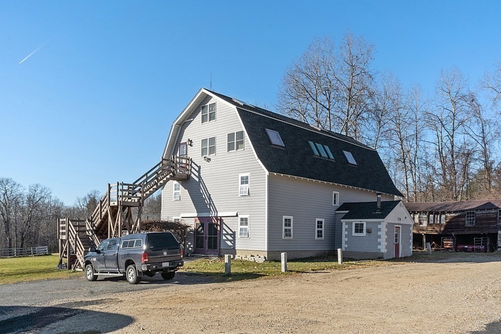 178 Wallace Hill Road Townsend, MA 01469 - Photo 41 of 42 a view of a building with cars park