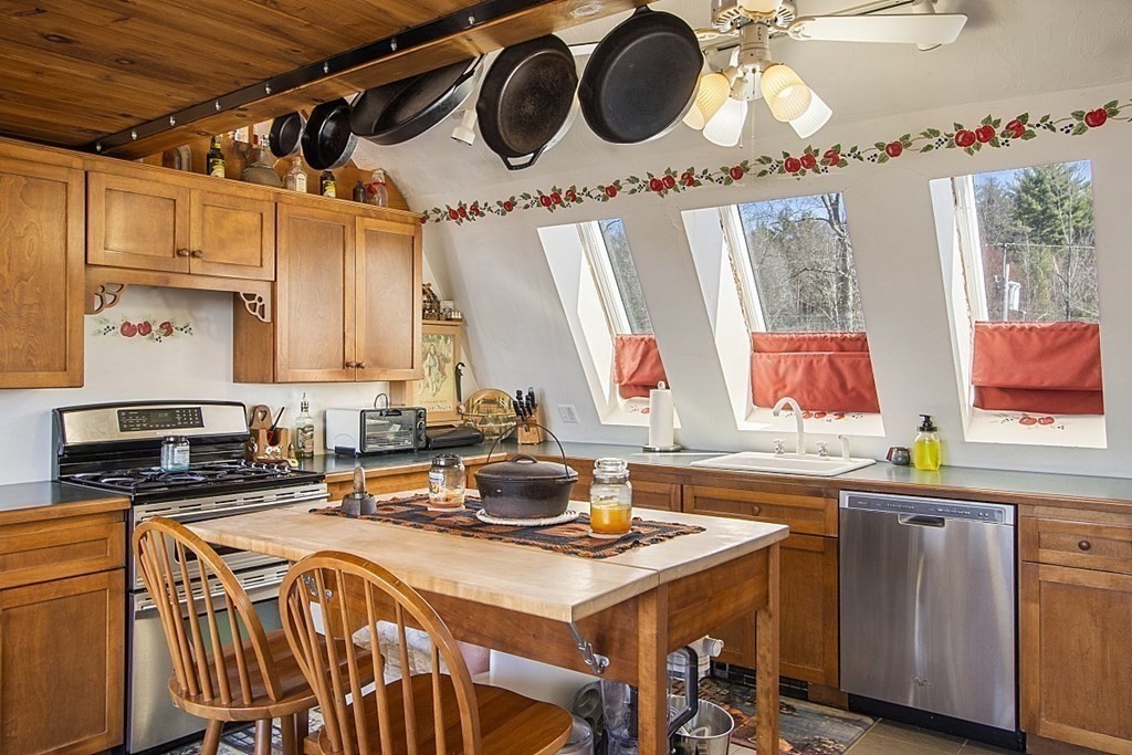 178 Wallace Hill Road Townsend, MA 01469 - Photo 5 of 42 a kitchen with a stove a sink and cabinets