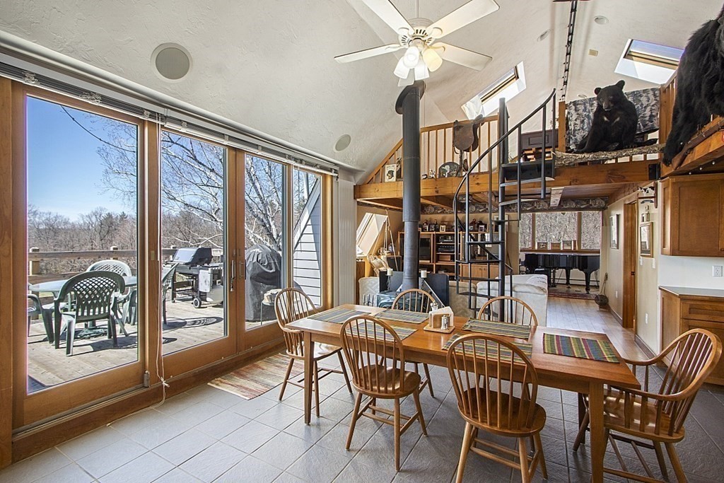 178 Wallace Hill Road Townsend, MA 01469 - Photo 8 of 42 a view of a dining room with furniture large window and chandelier