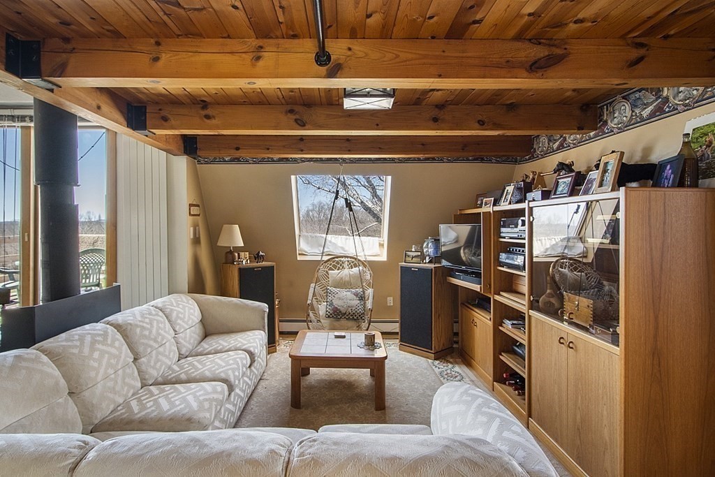 178 Wallace Hill Road Townsend, MA 01469 - Photo 10 of 42 a living room with furniture with a kitchen