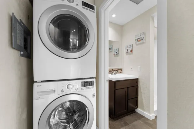 a view of a hallway with washer and dryer