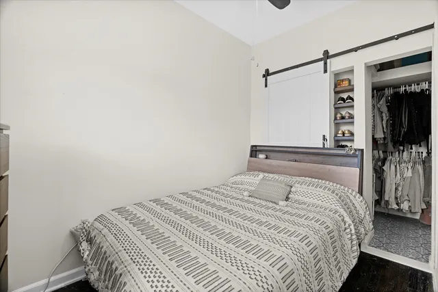 a bedroom with a bed and a walk in closet