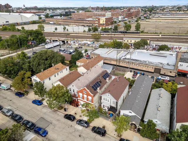 an aerial view of a house with a lake view