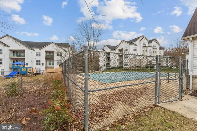 a view of a town with entryway and front view of a house
