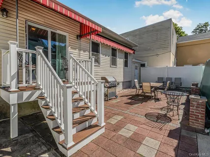 a backyard of a house with seating space