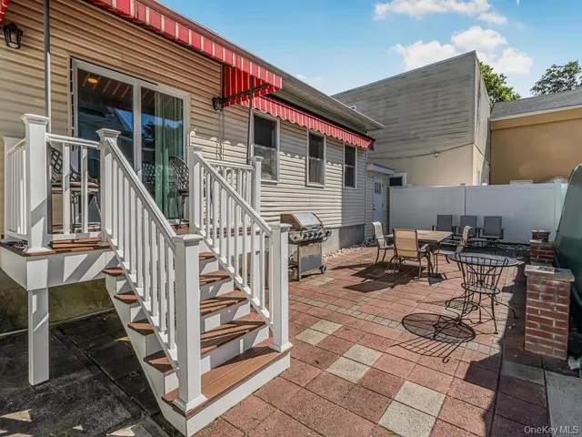 a backyard of a house with seating space
