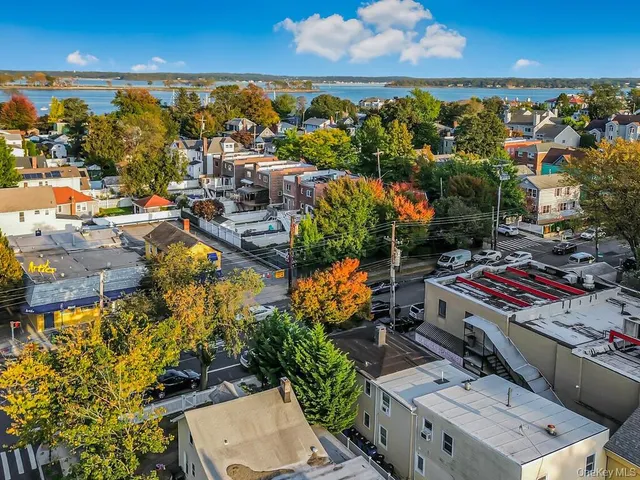 an aerial view of residential houses with outdoor space