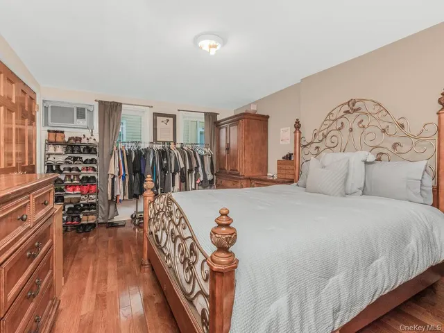 a bedroom with bed and window