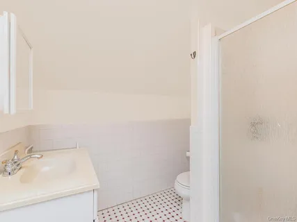 a bathroom with a sink toilet and vanity