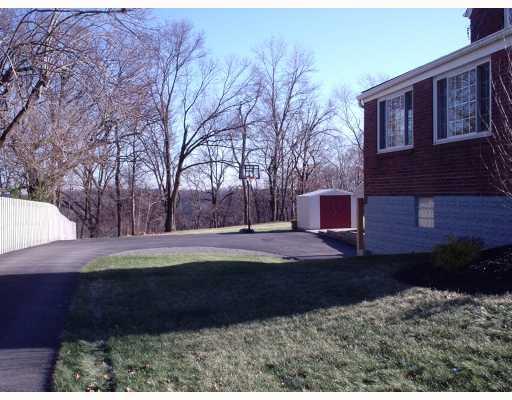 930 Ridge Road Ambridge, PA 15003 - Photo 2 of 16 Exterior Front. Side View from Asphalt Driveway and Shed in rear. Also, showing large level back yard.