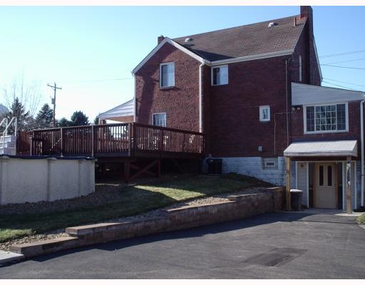 930 Ridge Road Ambridge, PA 15003 - Photo 3 of 16 Other. View showing back of house with pool and deck. Rear entrance was originally a garage door, could be converted back to garage, easily.