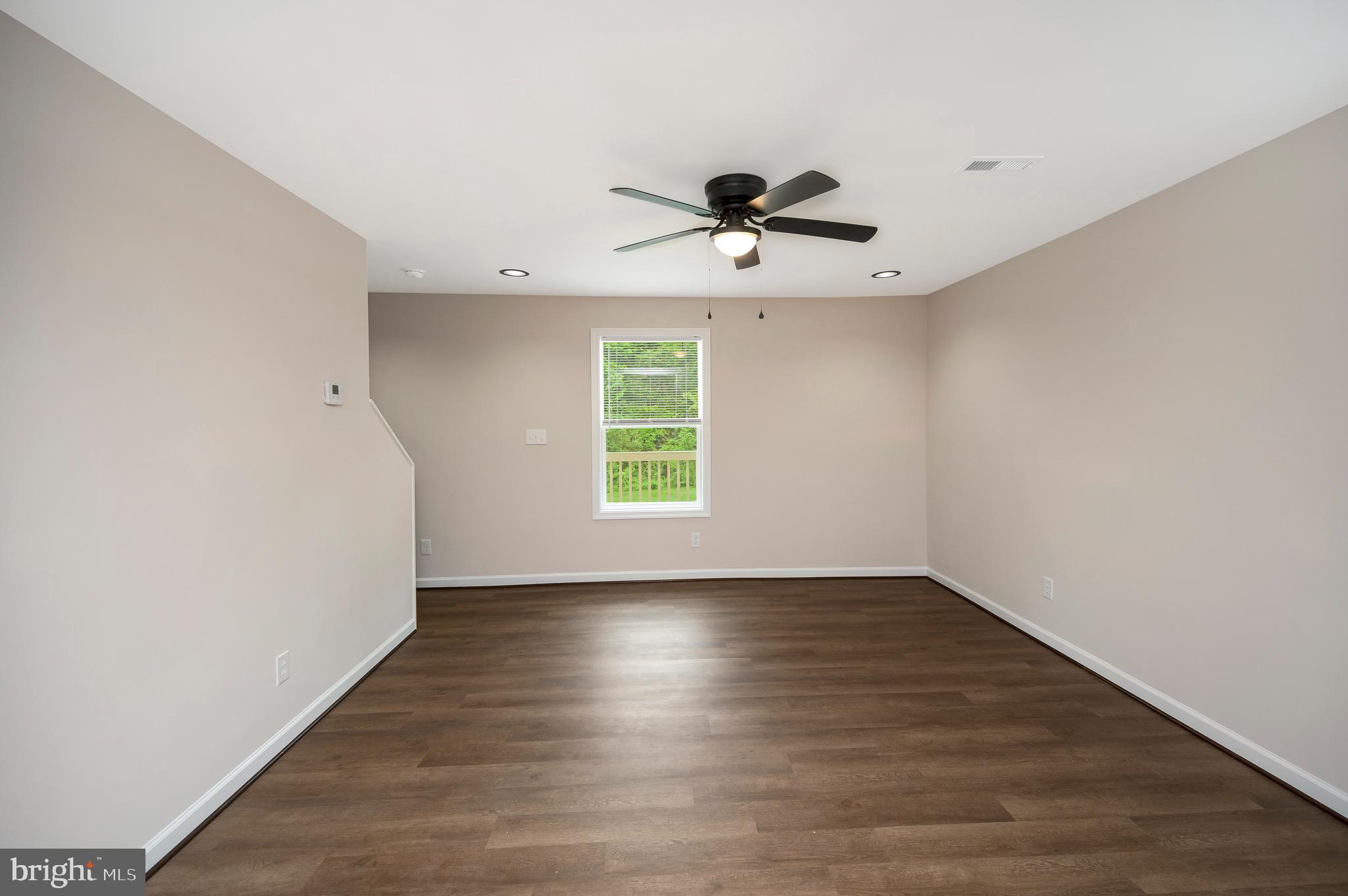 14169 Silver Hill Road Sumerduck, VA 22742 - Photo 6 of 40 a view of room with hardwood floor and window