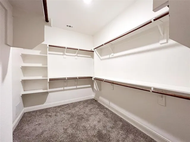 a view of an empty walk in closet