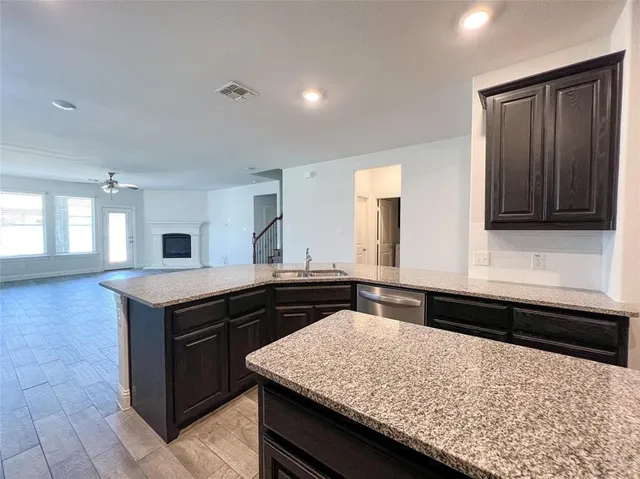 a kitchen with a stove and a sink