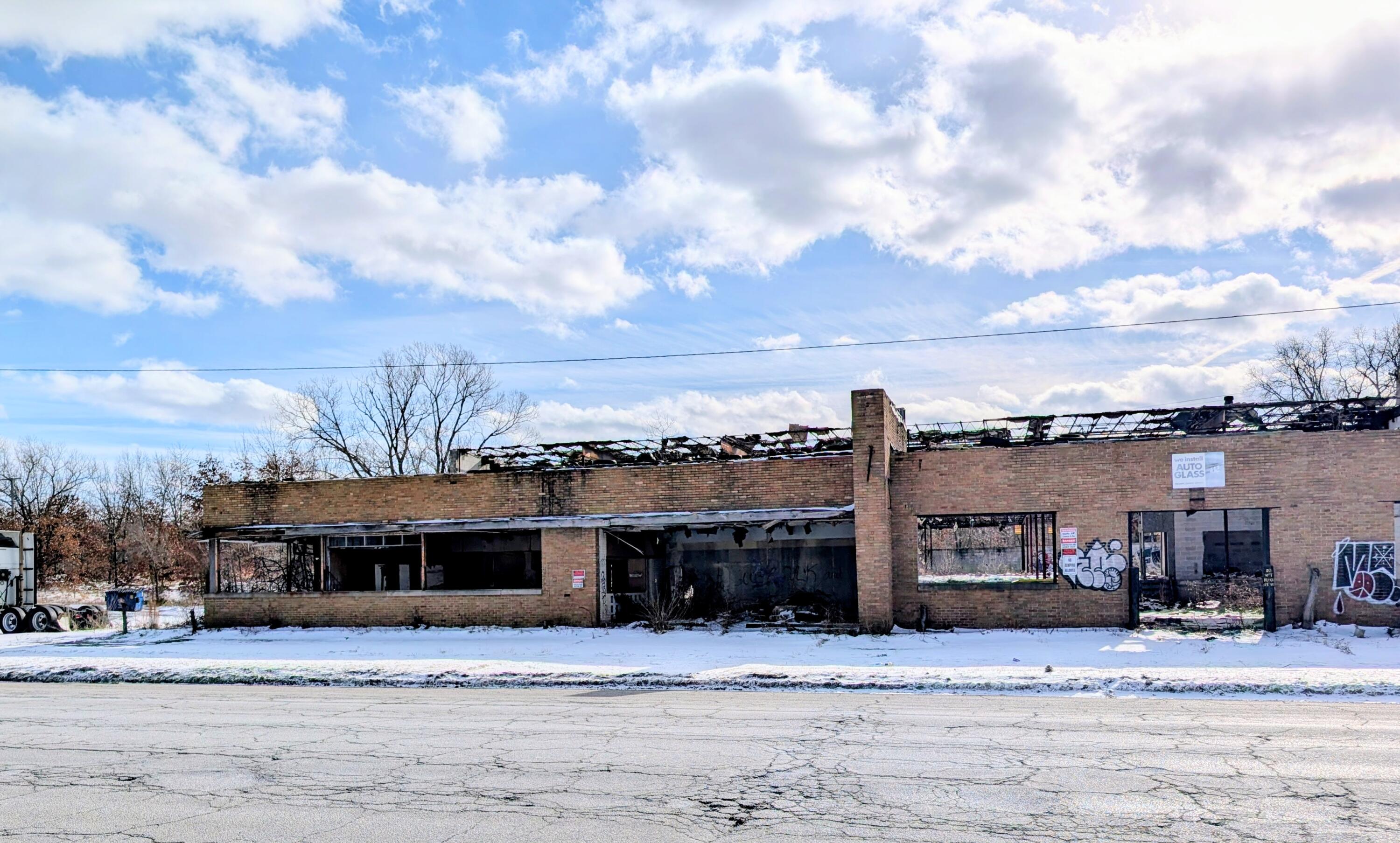 1301 West Ridge Road Gary, IN 46408 - Photo 2 of 5 a front view of a house with a yard and lake view